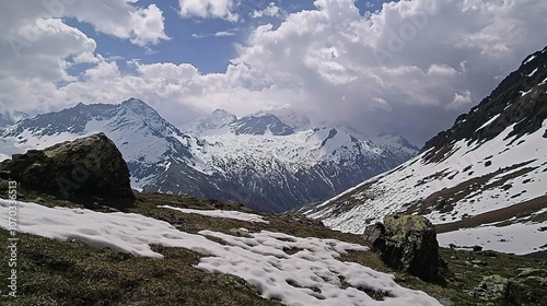 Majestic Snowy Mountain Landscape Under Cloudy Sky