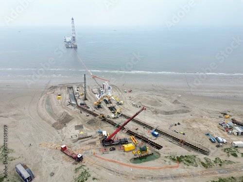 Cuadro en lienzo Connecting a seacable from an offshore windpark to an onshore power hub in Wijk