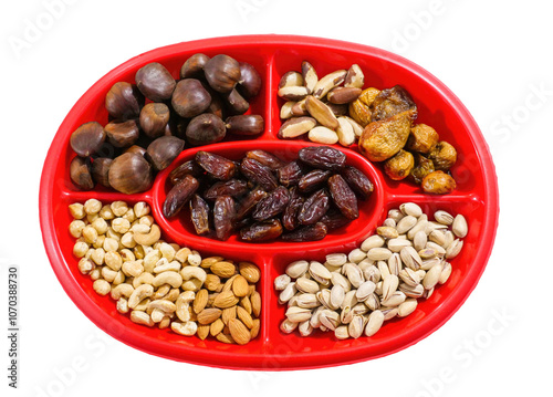 Red divided platter presenting assortment of nuts and dried fruits