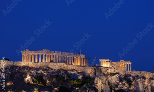 Parthenon illuminating the athenian acropolis at twilight, greece photo