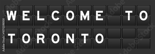 Black color analog flip board with word welcome to toronto on gray background