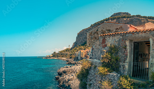 Fototapeta Naklejka Na Ścianę i Meble -  Old town of Cefalu in Sicily, Italy in a beautiful summer day. Travel and sightseeing journey concept. Rocky bay and blue sea