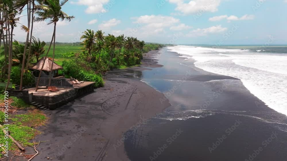 Black beach in Bali, Indonesia. Sand background. Summer seascape, Aerial drone view of sea and tropical island with black beach in Bali, Indonesia, Summer landscape, Aerial view of beach at sunset