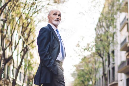 Wallpaper Mural Confident senior businessman in suit stepping road on street Torontodigital.ca