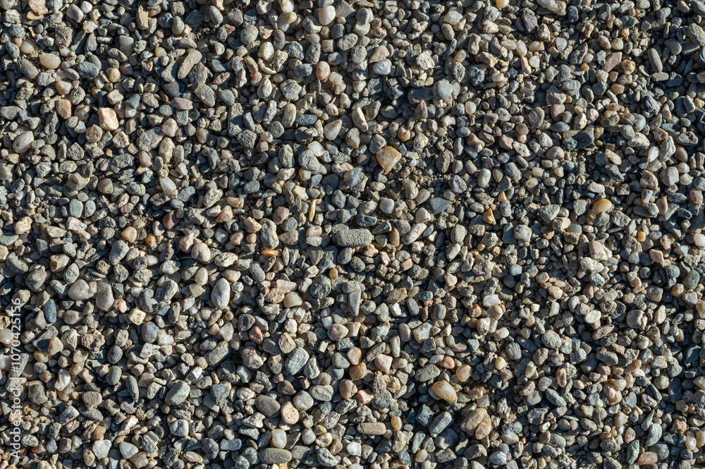 Background with texture of pebbles, small gravel raw material in the manufacture of concrete. Background with texture of pebbles, small gravel raw material in the manufacture of concrete.