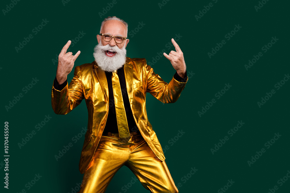 Charismatic elderly man in golden suit celebrating with flair on green background Charismatic elderly man in golden suit celebrating with flair on green background
