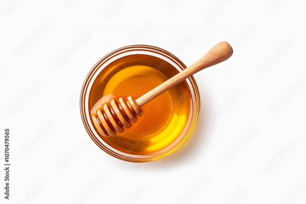 Honey with wooden honey dipper in white bowl isolated on white background Honey with wooden honey dipper in white bowl isolated on white background