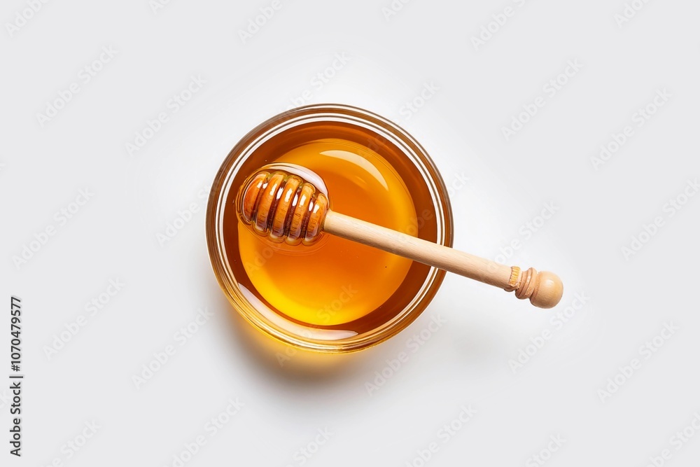 Honey with wooden honey dipper in white bowl isolated on white background Honey with wooden honey dipper in white bowl isolated on white background