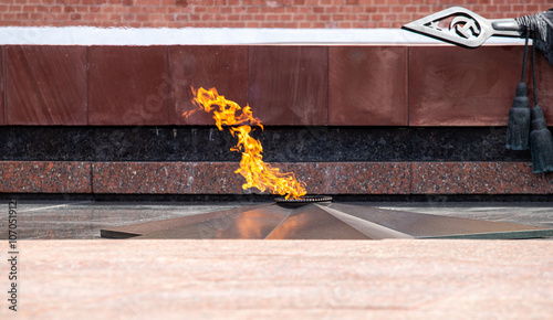 A fire is burning in a small pool of water photo