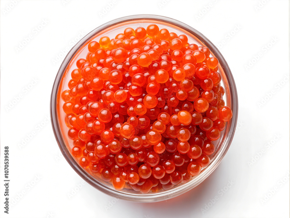 Red salmon caviar isolated on a white background, view from above. Delicious red caviar. Red salmon caviar isolated on a white background, view from above. Delicious red caviar.