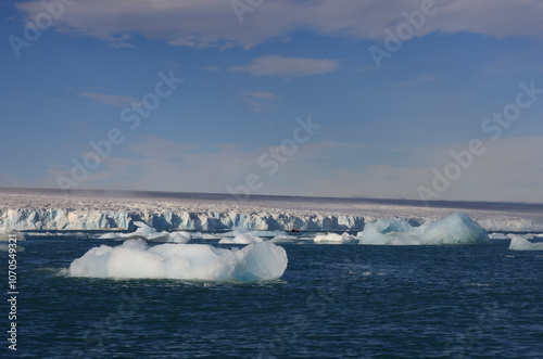 Iceberg drifting in the sea in front of the Austofonna Ice Cap photo