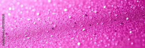 A close-up of pink glitter reflecting the light, creating a dazzling display