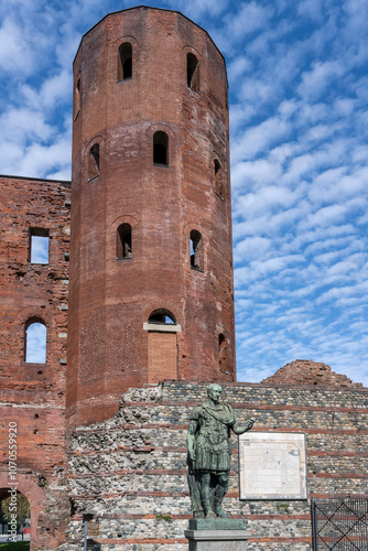 Julius Caesar statue and sixteen sided tower at Porta Palatina, Roman city gate, Torino, Italy