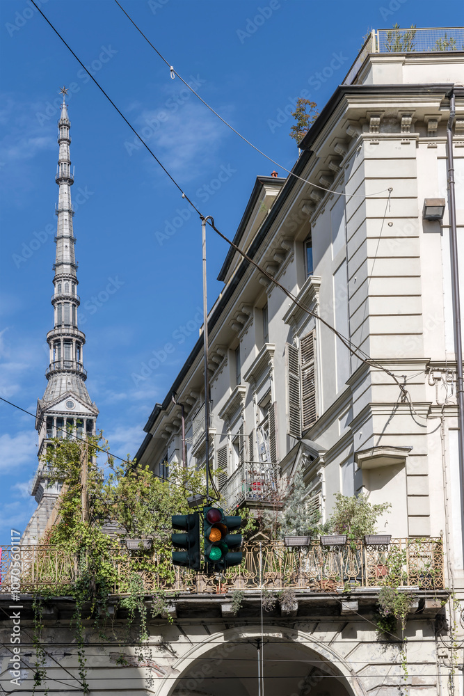 Fototapeta premium Mole Antonelliana spire looms out of terrace, Torino, Italy