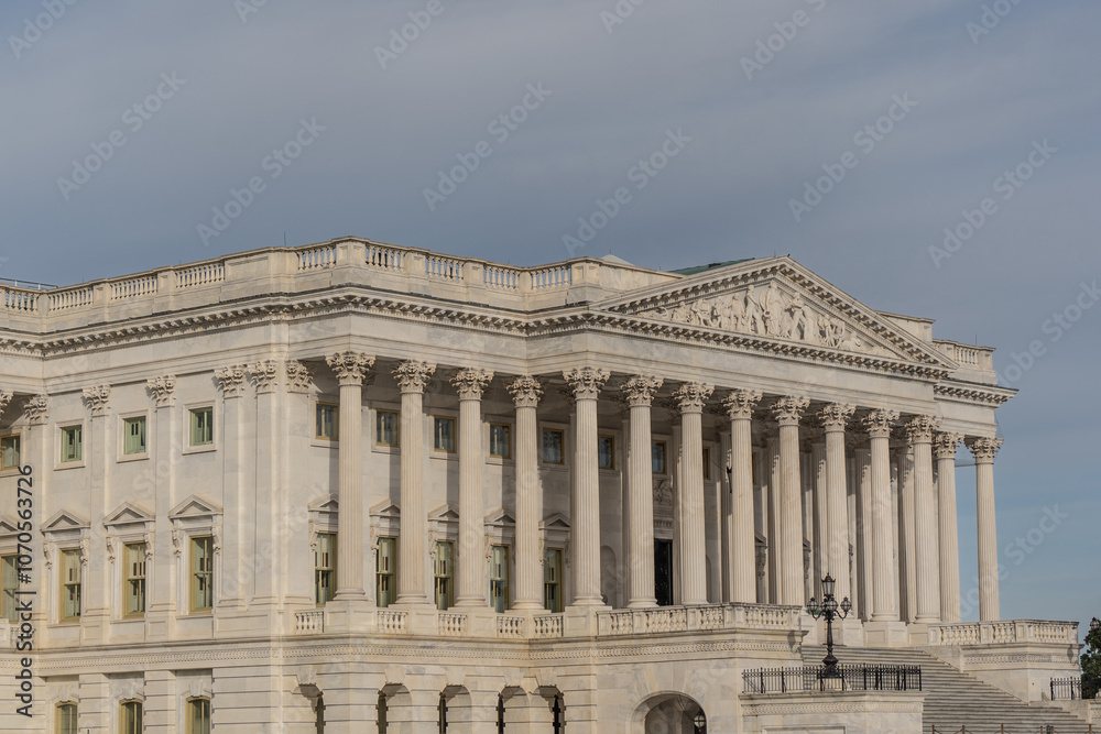 Senate Wing of the US Capitol Complex with blue sky background Senate Wing of the US Capitol Complex with blue sky background