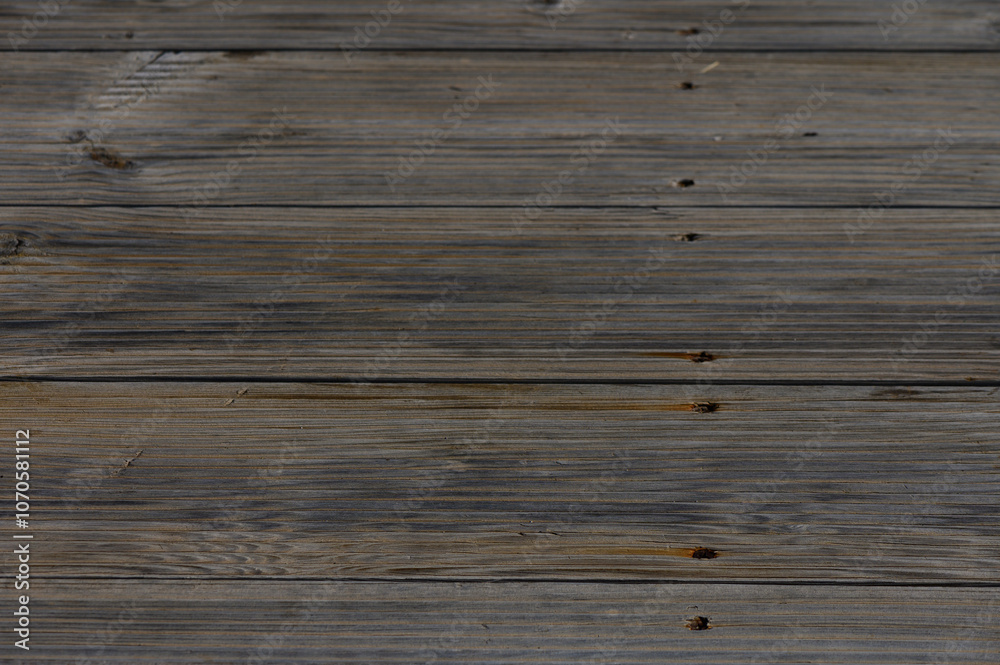 Rustic wooden floorboards displaying rich textures and warm tones in a cozy interior setting Rustic wooden floorboards displaying rich textures and warm tones in a cozy interior setting