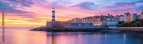 Tranquil dusk at the Ceuta coastline with a lighthouse and vibrant sunset reflecting on calm waters