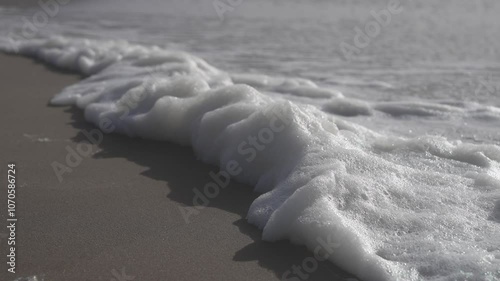 Foam at a beach in winter (North Sea, Netherlands)