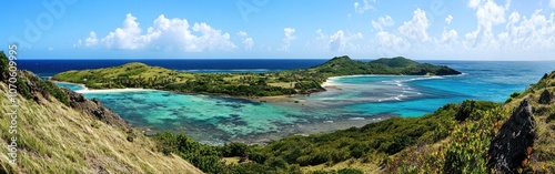 Panoramic view of a serene tropical beach landscape with turquoise waters, lush greenery, and distant hills on a sunny day