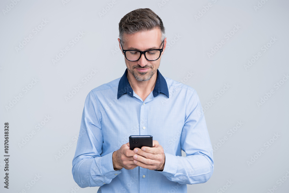 Businessman chatting. Businessman texting and messaging. Social network. Mature business man with phone. Businessman using phone. Man phone conversation isolated on grey. Chat support Businessman chatting. Businessman texting and messaging. Social network. Mature business man with phone. Businessman using phone. Man phone conversation isolated on grey. Chat support