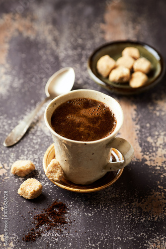 Mug of coffee on rustic wooden background. Copy space.