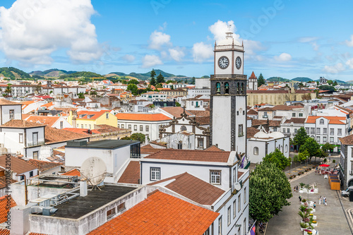 A view over the rooftops towards the Main Church of San Sebastian in Ponta Delgada on the island of Sao Miguel in the Azores in summertime photo