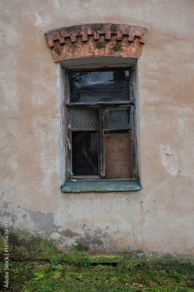 Old wooden window on the ancient abandoned house Old wooden window on the ancient abandoned house