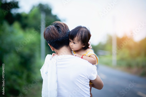 Loving mom and one year old baby enjoying time outside