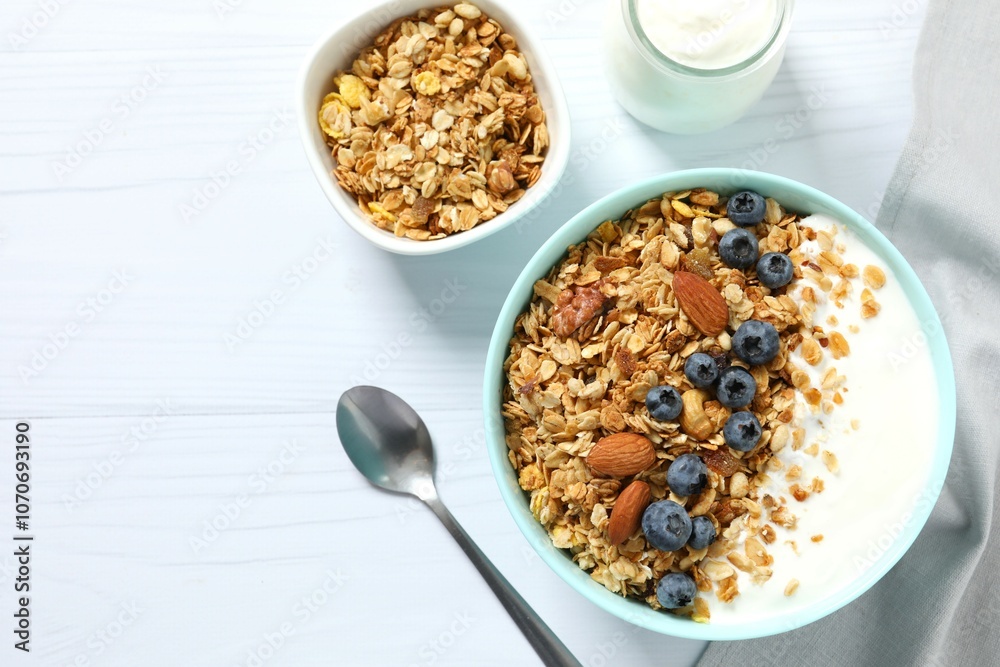 Delicious granola with berries and yogurt on the table Delicious granola with berries and yogurt on the table