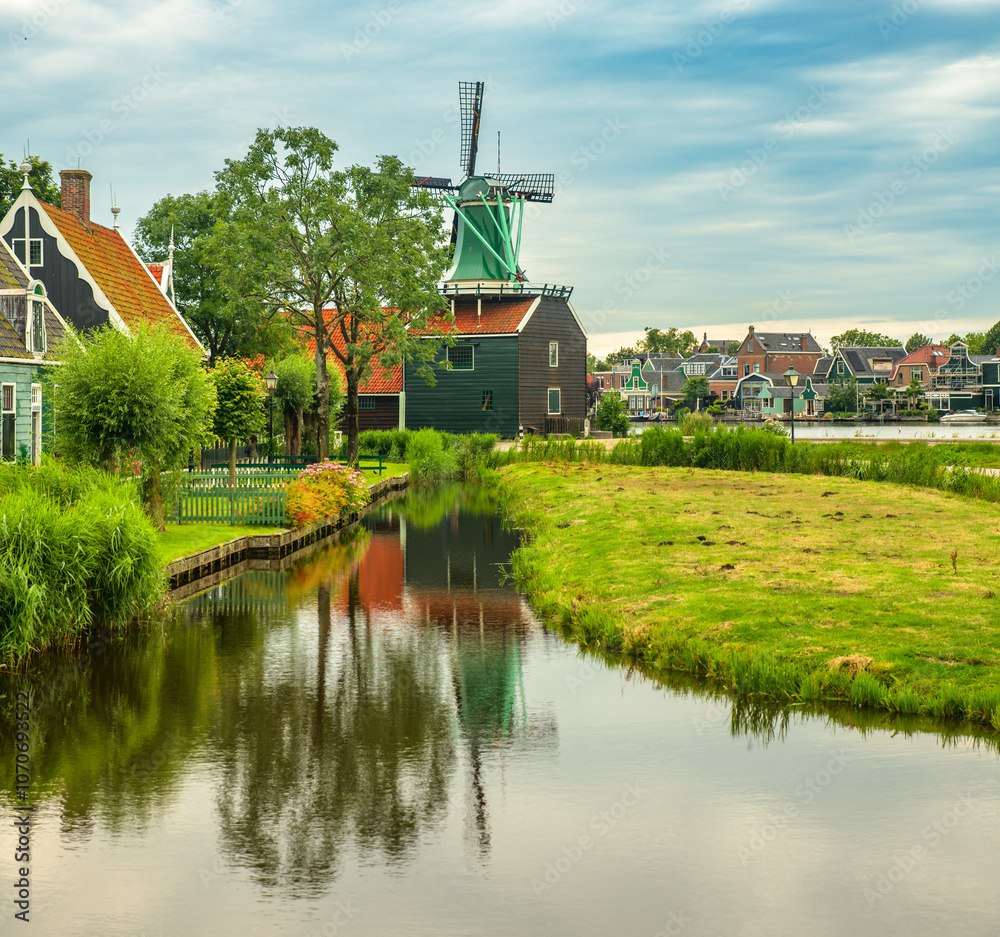 Traditional village with old houses and windmills in Netherlands