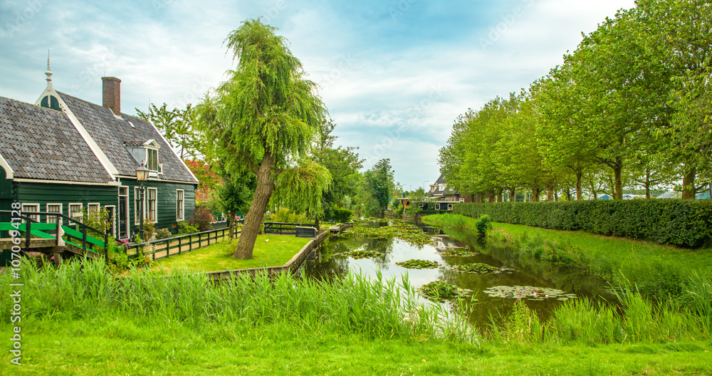 Traditional village with old houses and windmills in Netherlands