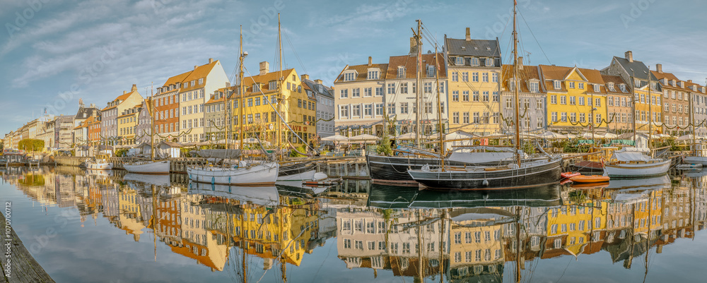 Panorama of Copenhagen New Harbour and its picturesque buildings reflected in the water