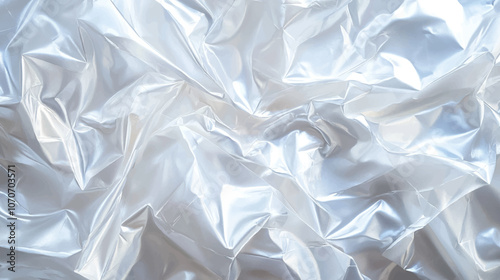 A close-up of the transparent plastic wrap material, with clear textures and a glossy surface. The background is white to highlight the texture of each layer of the wrapping film.