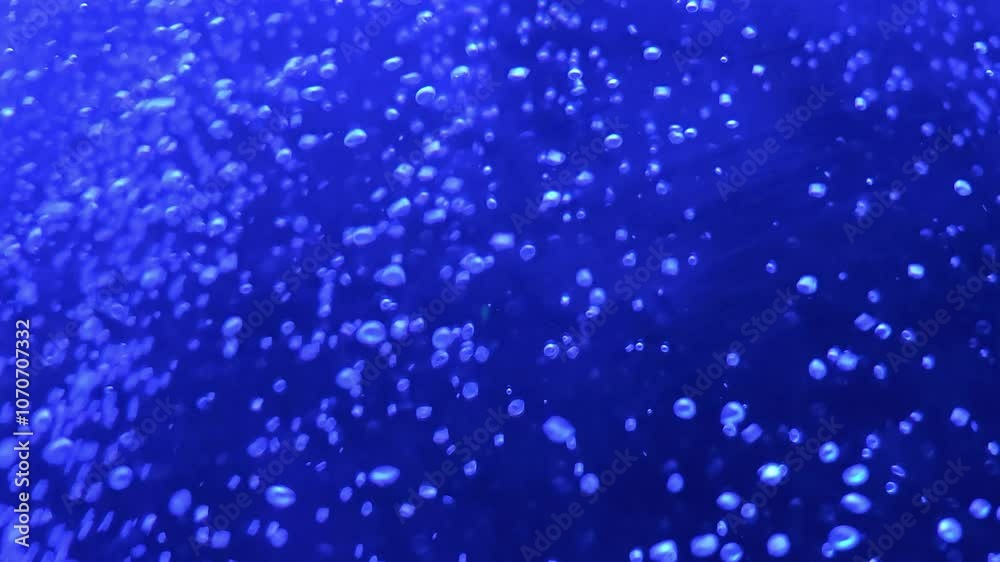 Water bubble blue oxygen air, in underwater clear liquid with bubbles flowing up on the water surface. Background. Water bubble blue oxygen air, in underwater clear liquid with bubbles flowing up on the water surface. Background.