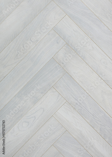 the texture of the wooden floor covering in a herringbone pattern. close-up photo of the surface photo