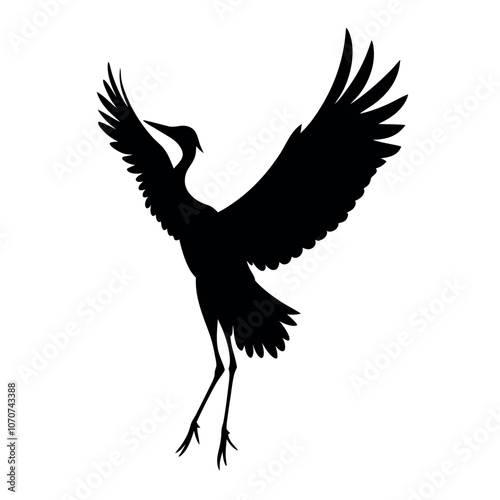 a black silhouette of a crane in flight isolated white background