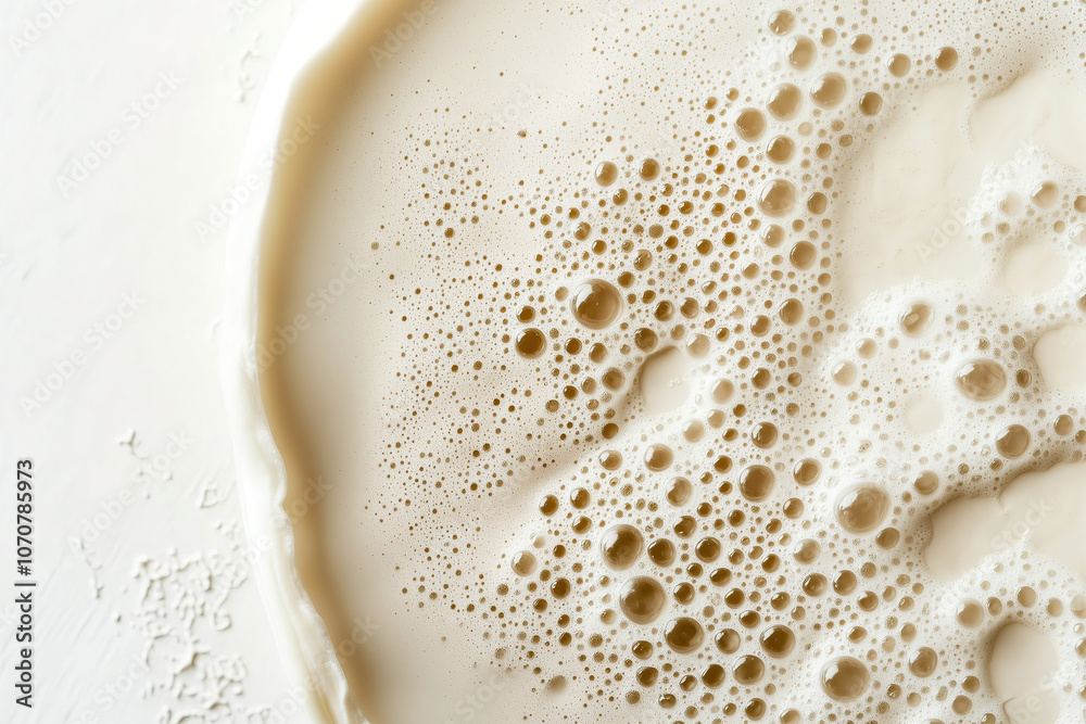 Bubbling yeast mixture for baking bread on a white countertop during the morning preparation. Generative AI Bubbling yeast mixture for baking bread on a white countertop during the morning preparation. Generative AI
