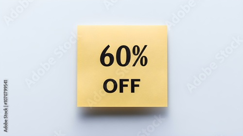 Black '60% OFF' Text on a Gold Square Paper Note. White Background with Copy Space