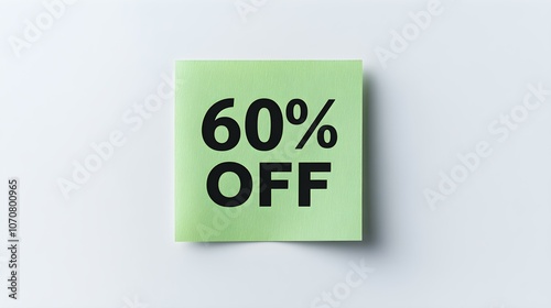 Black '60% OFF' Text on a Green Square Paper Note. White Background with Copy Space