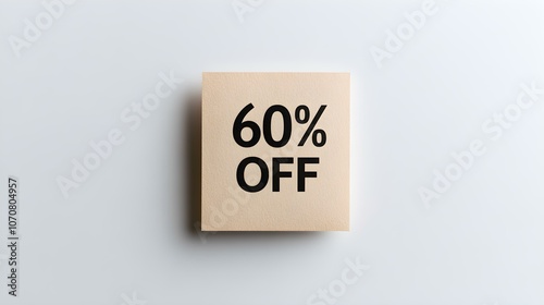 Black '60% OFF' Text on a Light Brown Square Paper Note. White Background with Copy Space