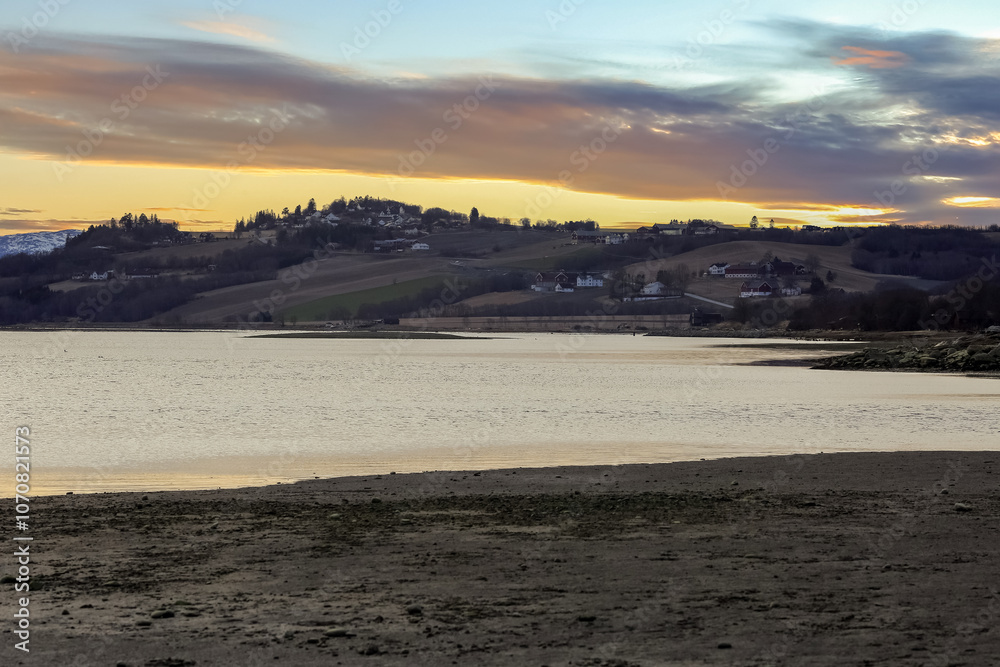Spring in Norway, sunset at Trondheim fjord and river Gaula Spring in Norway, sunset at Trondheim fjord and river Gaula