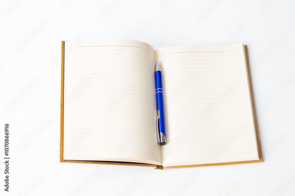 Lined notebook and blue pen, Open notebook isolated on white background. Journaling, writing idea concept. Lined notebook and blue pen, Open notebook isolated on white background. Journaling, writing idea concept.