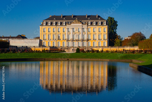 Baroque Palace with Reflecting Pool on a Sunny Day photo
