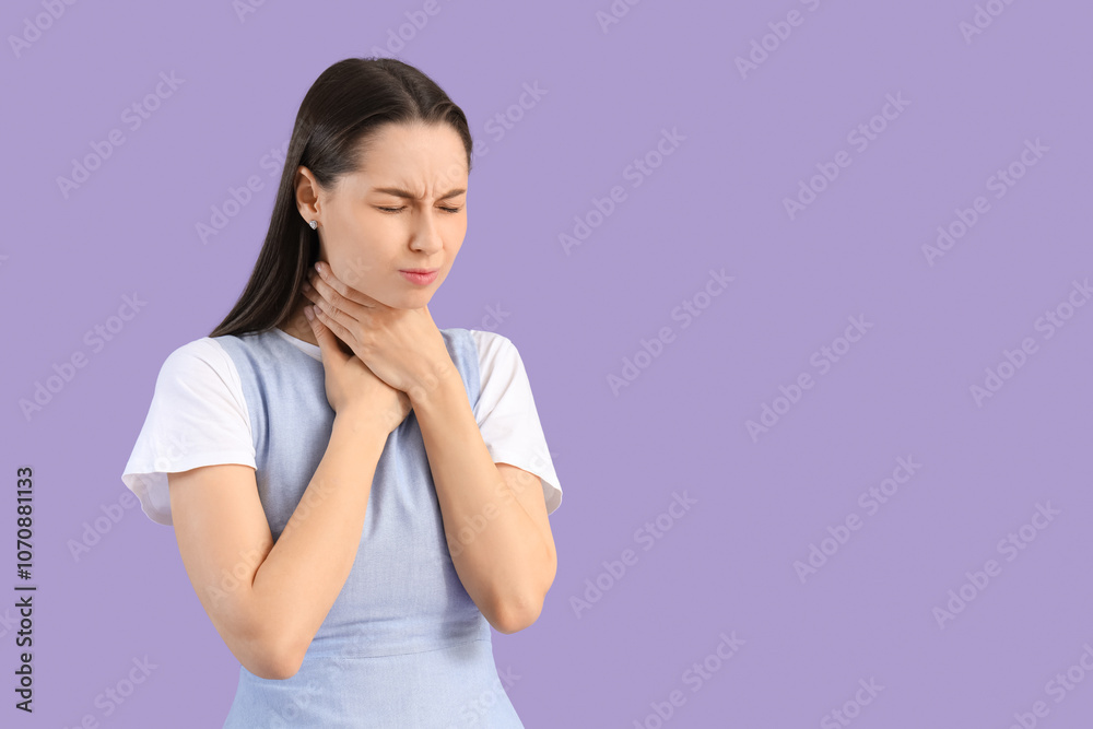 Young woman suffering from sore throat on lilac background Young woman suffering from sore throat on lilac background