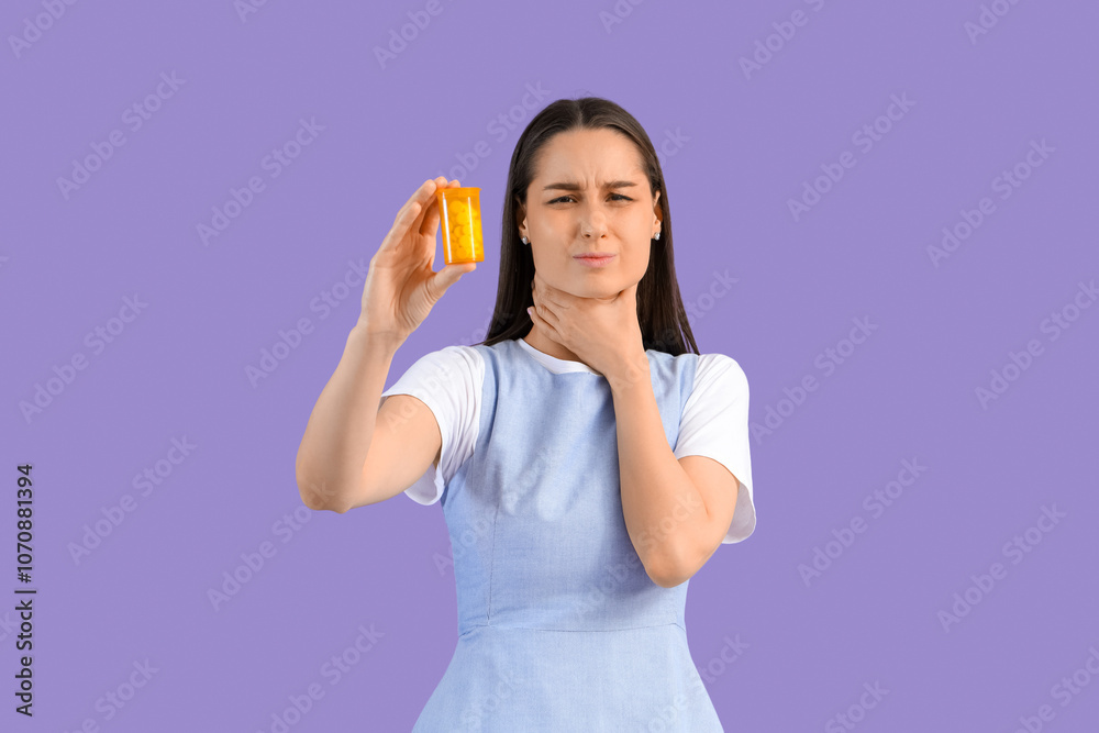 Young woman with pills for sore throat on lilac background Young woman with pills for sore throat on lilac background