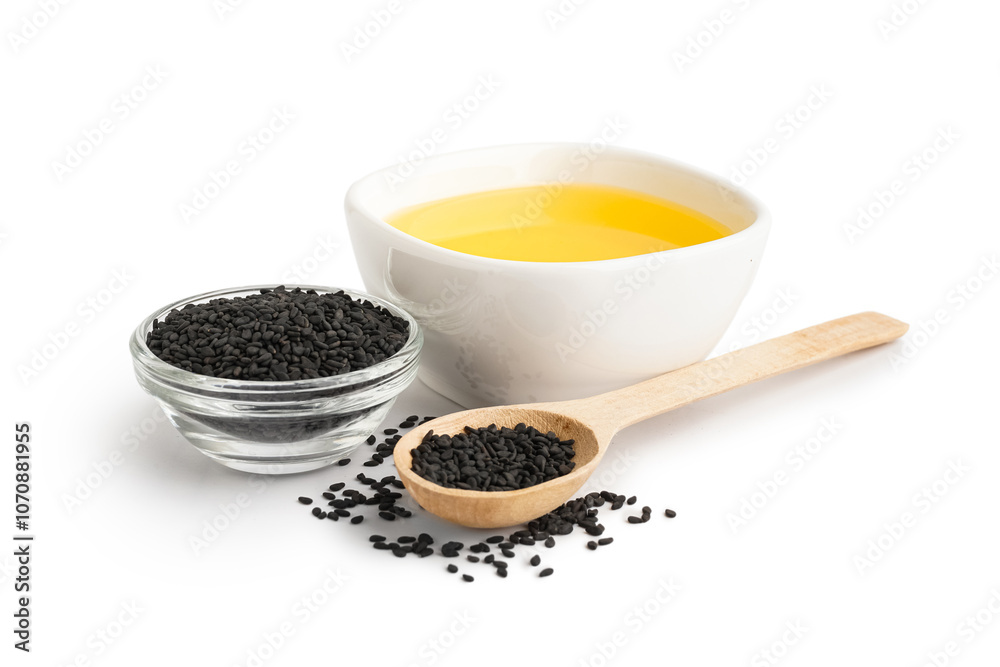 Bowl of oil and wooden spoon with sesame seeds on white background Bowl of oil and wooden spoon with sesame seeds on white background