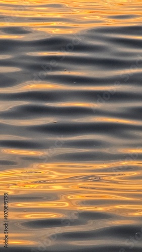 Sunset on the sea. The light of the setting sun reflects on the waves