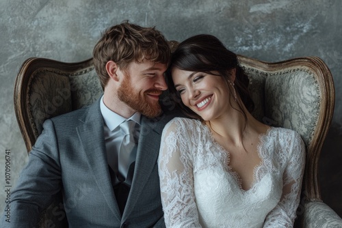 A pair of people relaxing together in a chair