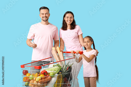 Happy family with full shop...