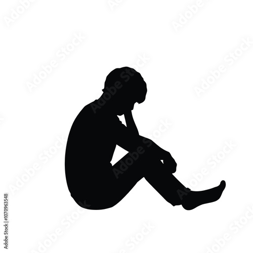 a black silhouette of a person sitting on the ground. The person is sitting with their legs crossed and their head resting on their knees